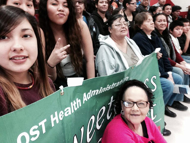 Yvonne "Tiny" DeCory of the Sweet Grass Suicide Prevention Program with children from her "Be Excited About Reading, suicide prevention and mentorship program. (Photo: Teton Saltes)